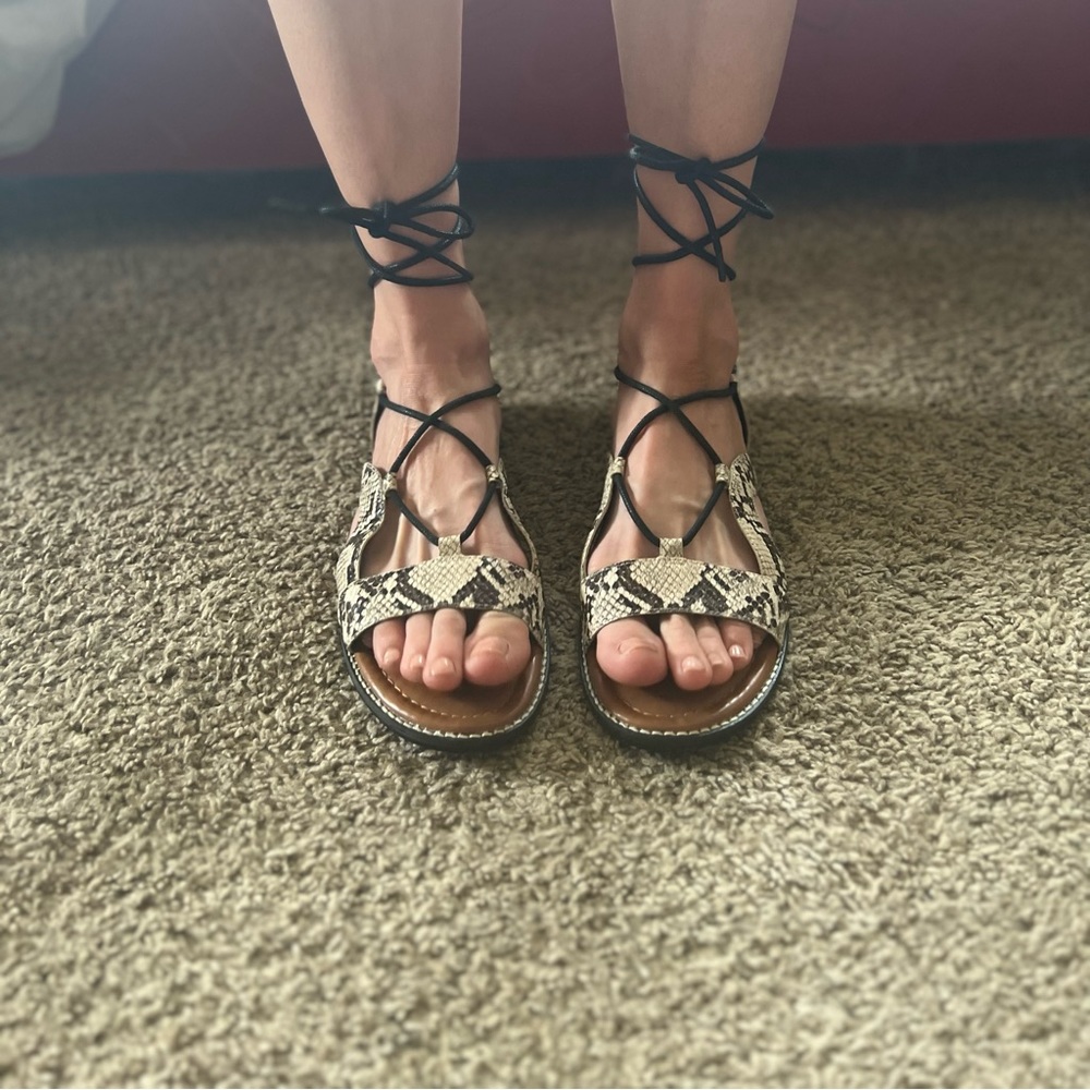 Snake print flat sandals that wrap up the calf